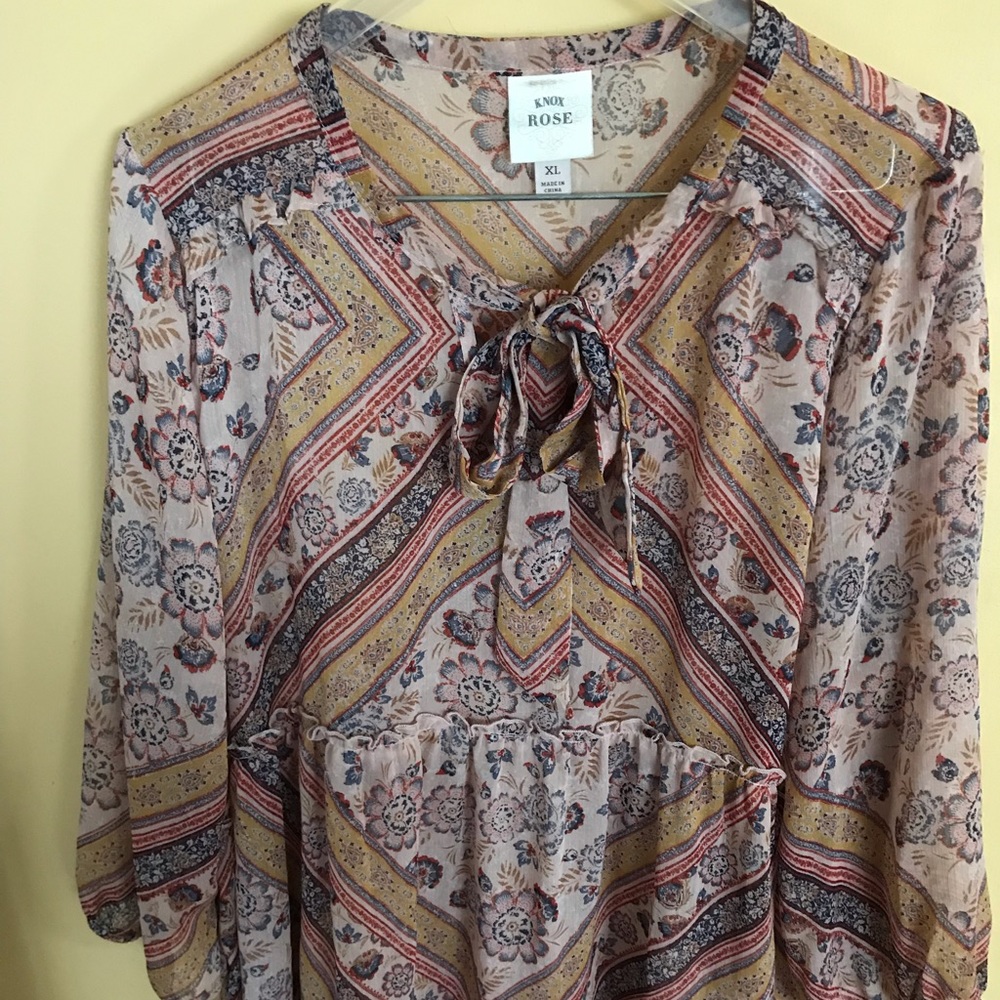 Rose printed sheer printed blouse.